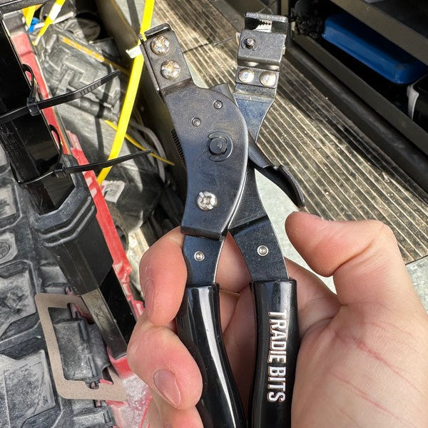 Squeeze the big handles to tension