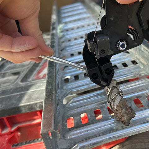 Push the silver lever to cut